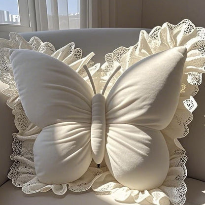 Elegantes Zierkissen in Schmetterlingsform mit Spitzenborte
