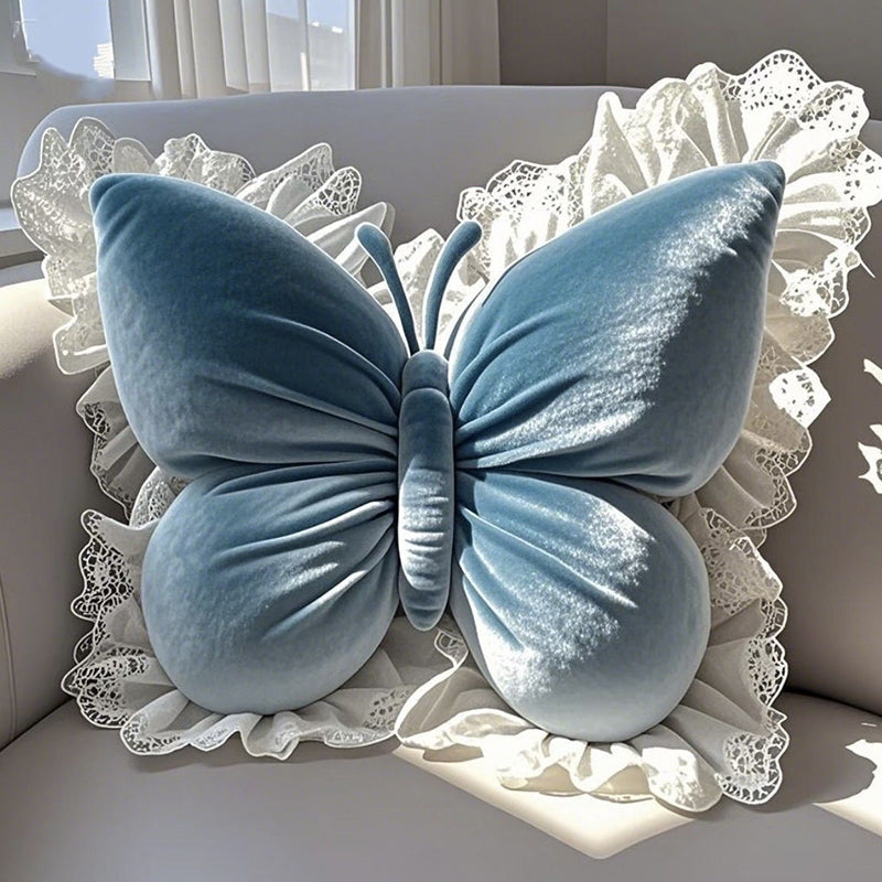 Elegantes Zierkissen in Schmetterlingsform mit Spitzenborte